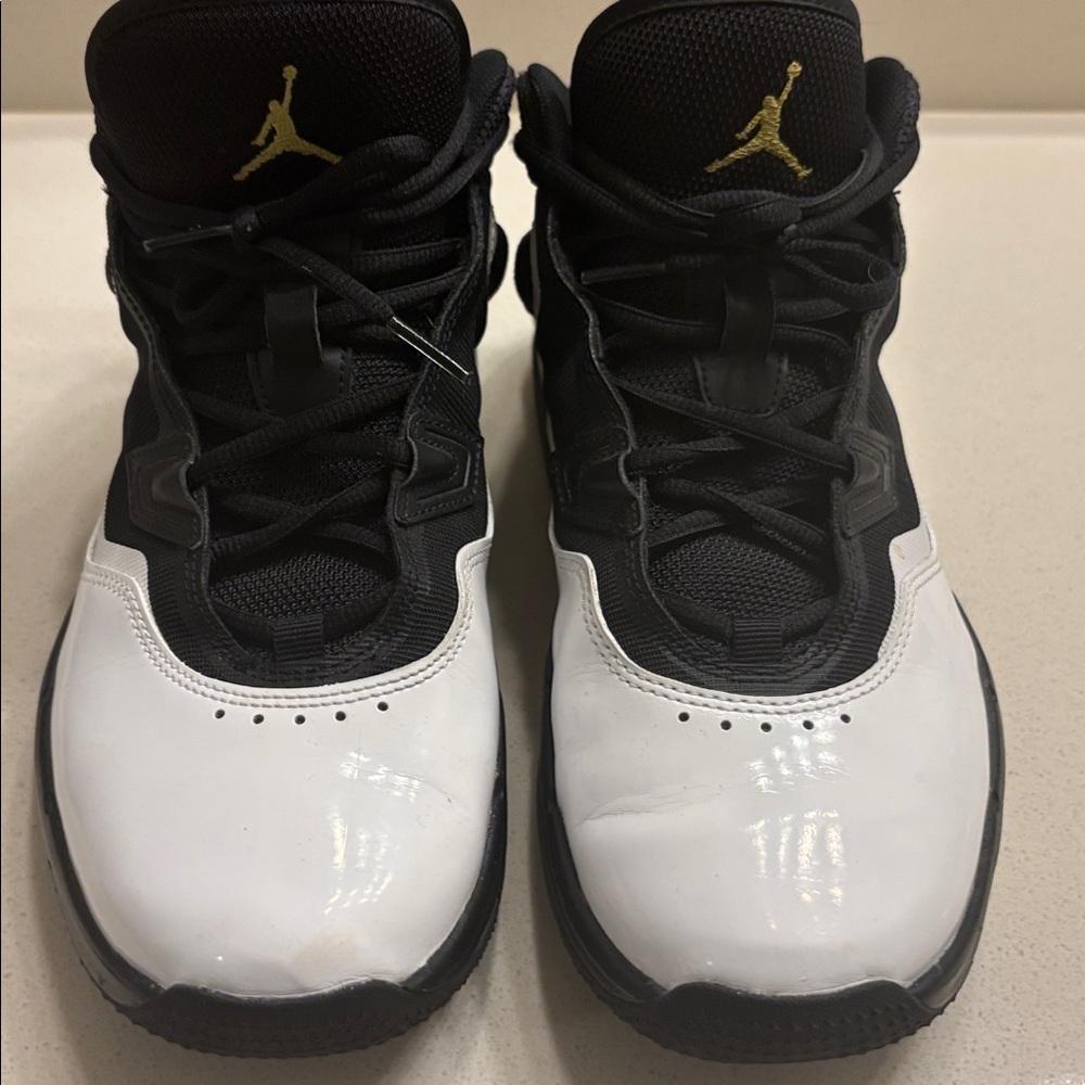 Jordan Nike Black and White Sneakers with Gold Accents
